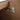 CharmyDecor floating double sink vanity close-up of the metallic door hinge against the wood-grain interior