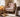 Charmydecor floral accent chair styled in a cozy bedroom reading corner with red and white botanical upholstery and wood legs