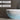 CharmyDecor freestanding solid surface bathtub close-up showing the curved end and tapered base.