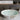 CharmyDecor freestanding solid surface bathtub shown filled with water in a split comparison graphic.
