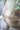 Decorative vase with white flowers on a blurred background