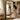 Charmydecor gold frame mirror in bedroom reflecting woman in floral dress, full length vintage mirror with antique gold ornate frame.