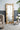 charmydecor gold full length floor mirror leaning in elegant bedroom or lounge space