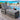 charmydecor gray wicker outdoor chaise lounge with armrests and cushions beside a pool