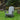 charmydecor grey folding Adirondack chair displayed on a green garden lawn