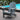 charmydecor grey HDPE folding Adirondack chair beside an outdoor swimming pool