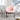 charmydecor hand woven rattan rocking chair front view with plush pink cushion