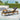 charmydecor Jason outdoor chaise lounge with gray cushion and acacia wood frame beside a pool