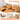 Brown leather sectional sofa with material details on a white background
