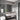 CharmyDecor lighted medicine cabinet with rounded corners above a floating sink in a grey tiled bathroom