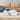 Charmydecor low-profile white faux marble coffee table displayed in front of a tan sofa
