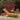 Charmydecor Maki yellow brown acacia wood patio chaise lounge in an outdoor garden setting