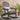 Charmydecor Malibu dark gray acacia wood Adirondack rocking chair styled on an outdoor patio