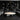 Charmydecor marble round coffee table in a dark modern lounge with black shelving and gray sectional sofa