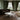 Charmydecor marble round coffee table in a luxury traditional living room with dark sofa and elegant green wall panels