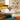 Charmydecor marble round coffee table with bold natural veining styled in a colorful retro inspired living room