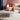Charmydecor marble round coffee table with honed white stone top in a colorful modern living room with boucle sofa