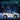 White toy car with cityscape background and text about extended playtime and speed.