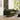 Green sofa in a living room with a window and decor