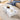 Charmydecor modern white faux marble coffee table viewed from above beside a sofa