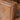 Close-up of a brown leather armchair with studded details