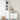 Charmydecor narrow bathroom storage cabinet beside matching white cabinet with towels and toiletries