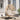 charmydecor natural PE rattan hanging egg chair with gray cushion set and black steel stand on a sunny front porch deck
