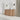 CharmyDecor oak-look bathroom vanity in an angled bathroom scene beneath a round mirror and wall sconces.