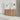 CharmyDecor oak-look bathroom vanity in an angled bathroom scene with a round mirror and wall sconces
