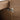 CharmyDecor oak-look bathroom vanity close-up of a door hinge against the wood-grain interior