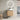 CharmyDecor oak-look floating bathroom vanity with patterned vessel sink in a bathroom beneath a round mirror