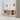 CharmyDecor oak-look floating bathroom vanity in an angled bathroom scene with towels arranged in the open side shelves.