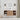 CharmyDecor oak-look floating bathroom vanity in a front-facing bathroom scene beneath a round mirror and sconces