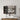CharmyDecor oak-look wall mounted medicine cabinet with doors open, showing toiletries and folded towels above a bathroom vanity