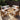 Charmydecor outdoor 7-seater acacia wood patio conversation set with beige cushions and coffee table on a backyard deck