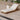 Charmydecor outdoor acacia wood chaise lounge with cream cushion on a poolside deck