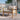 Charmydecor outdoor acacia wood lounge chair with beige cushions styled beside a pool and modern patio