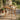 charmydecor outdoor acacia wood square dining table with natural teak finish styled on garden patio