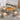 CharmyDecor outdoor dining set with acacia wood round table, four wicker chairs, and cream cushions on a modern patio