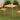 Orange outdoor table and chairs on grass with plants in the background
