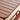 Close-up of a brown plastic chair with a blurred background
