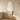 Oval full length wall mirror mounted in living room