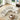 charmydecor overhead view of beige curved sectional sofa with pillows and coffee table