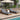 Charmydecor pair of adjustable outdoor chaise lounges with dark gray cushions on a shaded patio deck