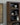 Wooden bookshelf with decorative items against a wall with a framed picture.