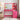 CharmyDecor rose pink makeup vanity with illuminated mirror and vertical organizer in a styled room, front view
