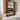 Wooden desk with computer and chair in a bedroom setting
