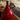 CharmyDecor red ceramic table lamp close-up of sculptural loop accent and glossy ceramic surface