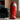 CharmyDecor red rocket trash can beside black leather chair in modern retro interior