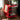 CharmyDecor rolling side table Bauhaus red design with storage beside modern chair